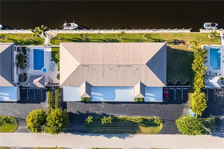 Aerial view of property and surrounding area with a pool