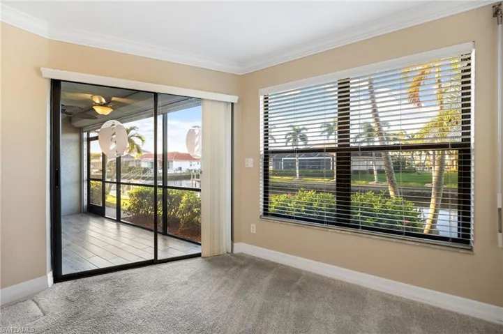 Primary room featuring carpet floors and ornamental molding