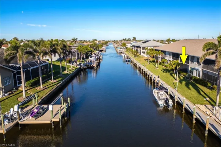 Dock area with boat lift and a water view