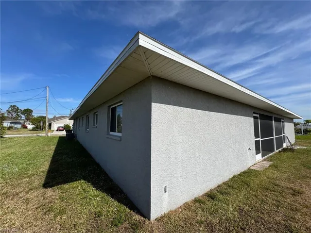 View of home's exterior with a lawn