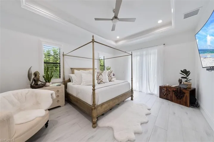 Owner's suite featuring french doors leading to the pool area.