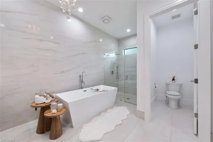 Owner's Bathroom showing water closet, tub and shower.
