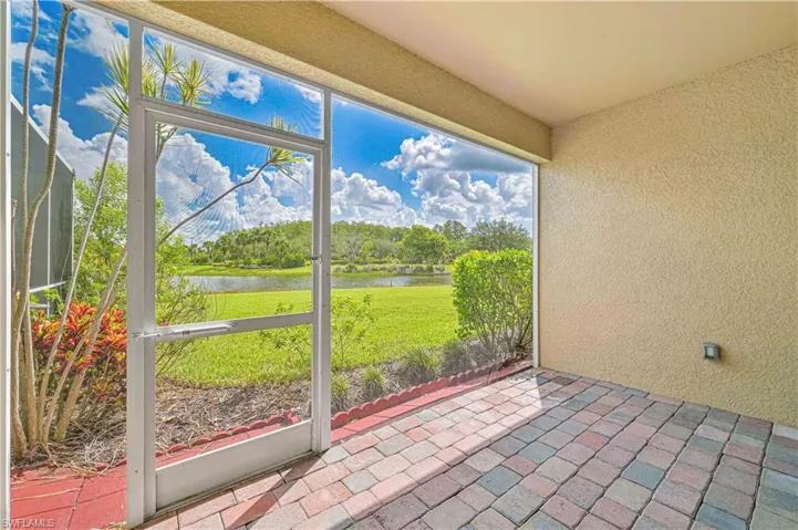 Unfurnished sunroom with a water view