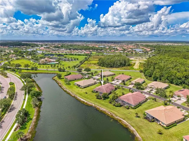Aerial view of residential area featuring a large body of water
