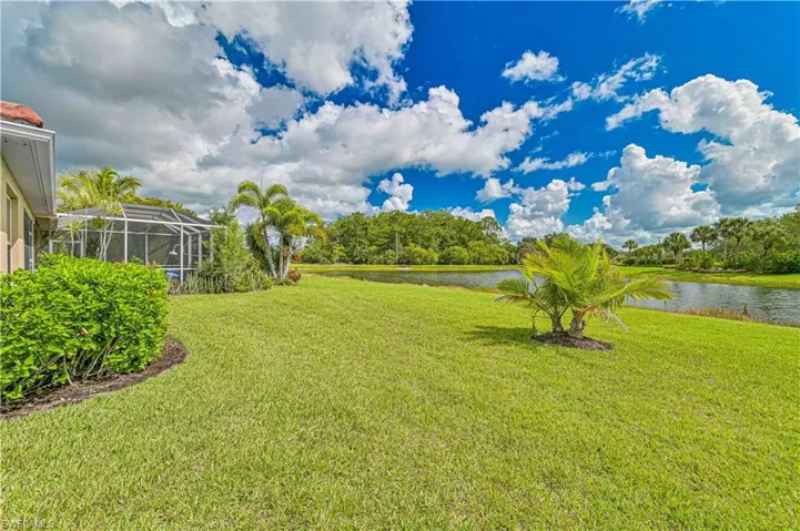 View of green lawn with a water view