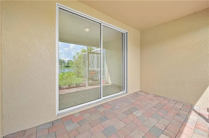 View of patio with a water view