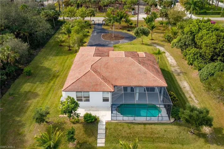 View of subject property with a pool area