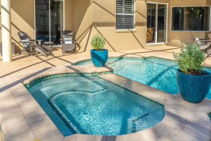 View of pool featuring an in ground hot tub and a patio area