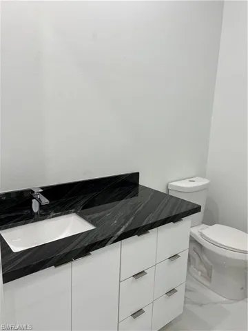 Bathroom with vanity and toilet