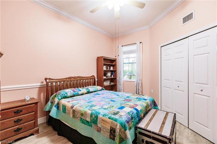 GUEST BEDROOM IS LARGE & ALSO HAS NEW WOOD FLOORING, CROWN MOLDING & "FLORIDIAN" COLORS!