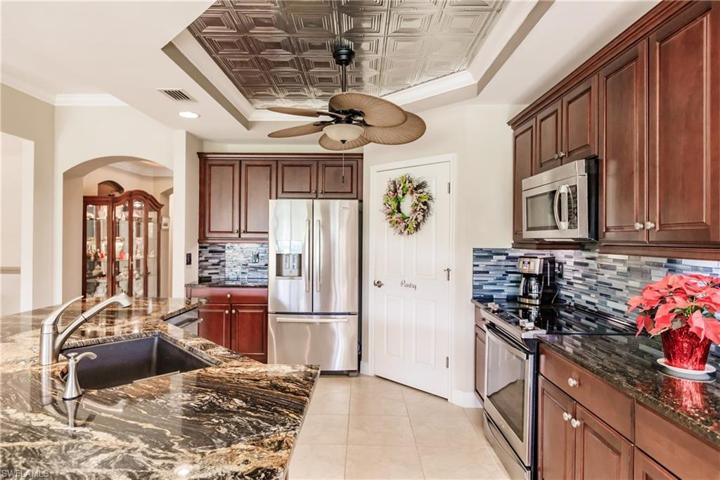 LEVEL 4 GRANITE COUNTERTOPS, BEAUTIFUL BACKSPLASH PLUS MODERN "TIN CEILING" EFFECT & UPGRADED APPLIANCES!