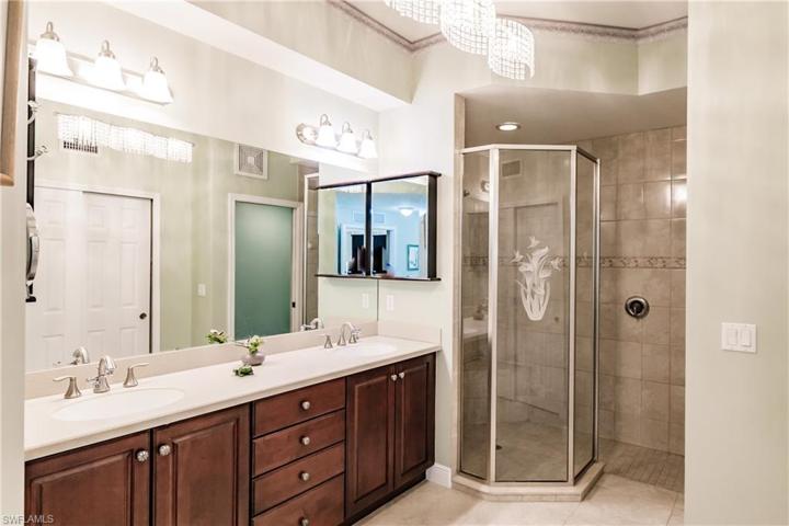 MASTER BATHROOM WITH UPDATED WALK IN SHOWER & UPGRADED VANITY CABINETS!