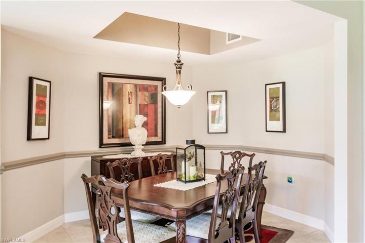 FORMAL DINING AREA WITH COFFERED CEILING & ELEGANT LIGHTING FOR SPECIAL OCCATIONS!