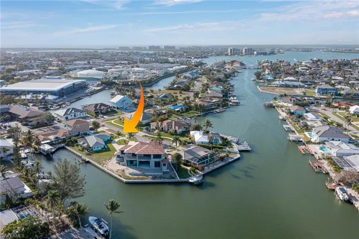 Aerial view featuring a residential view and a water view