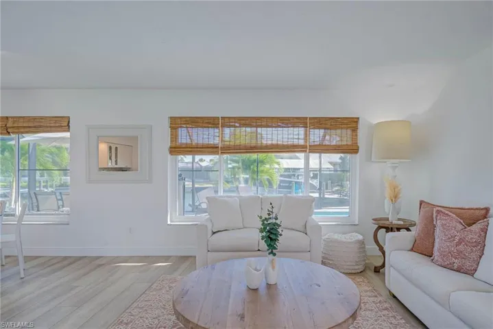 Living room featuring baseboards and light wood finished floors