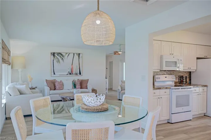 Dining area featuring light wood finished floors and ceiling fan