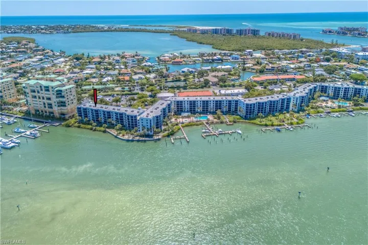 Birds eye view of property with a water view