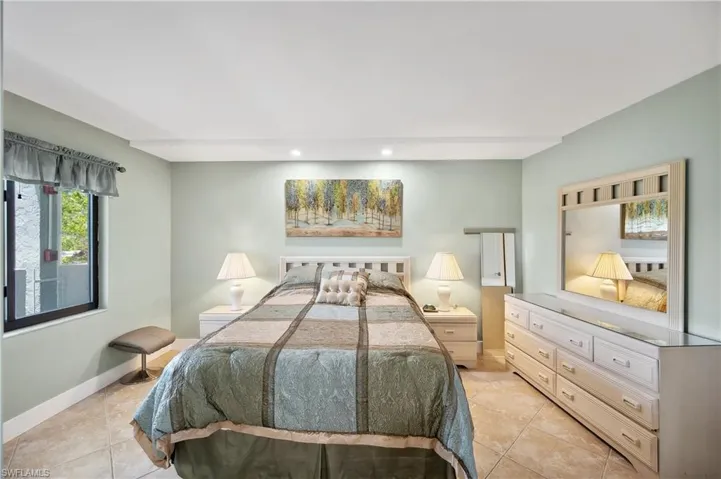 Bedroom with light tile floors