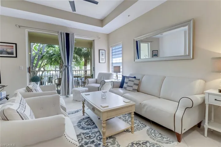 A bright and airy living space welcomes you, accented with volume, tray ceilings.