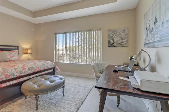 The primary suite, along with the other bedrooms have been adorned with luxury wood-like vinyl flooring.