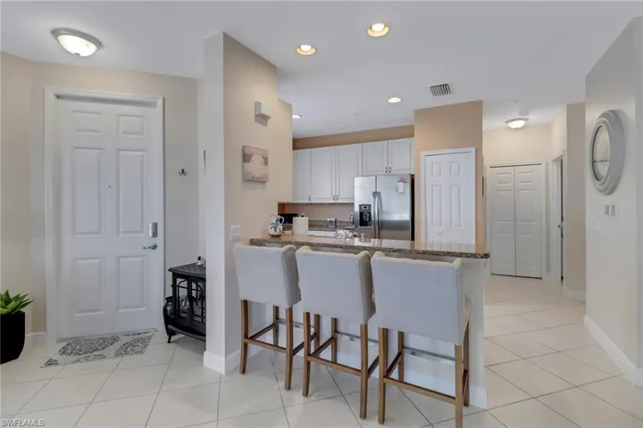 The kitchen offers a breakfast bar for those quick bites on your way to the tennis court!