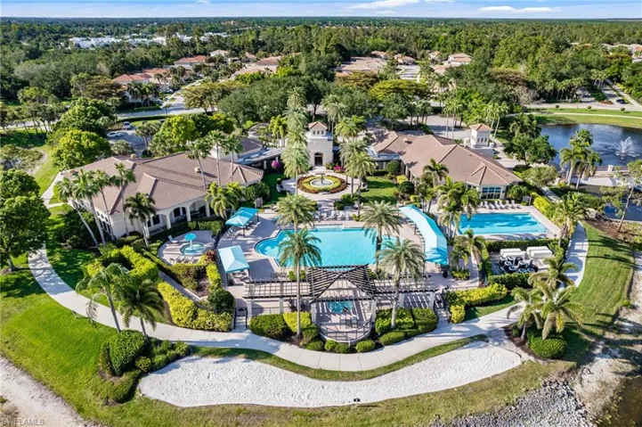 Resort style amenities await! Resort style pool AND lap pool, lakefront beach, tennis courts, and clubhouse