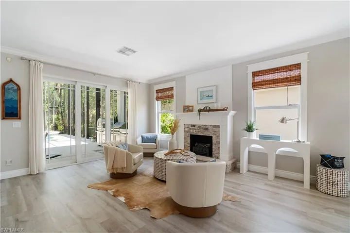 Custom electric fireplace, mahogany doors, and new window trim all add to the charm and quality redesign of this home