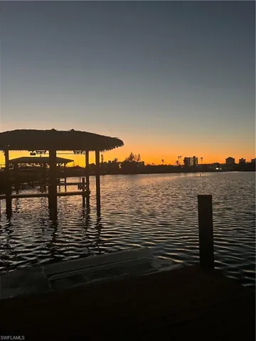 Dock area featuring a water view