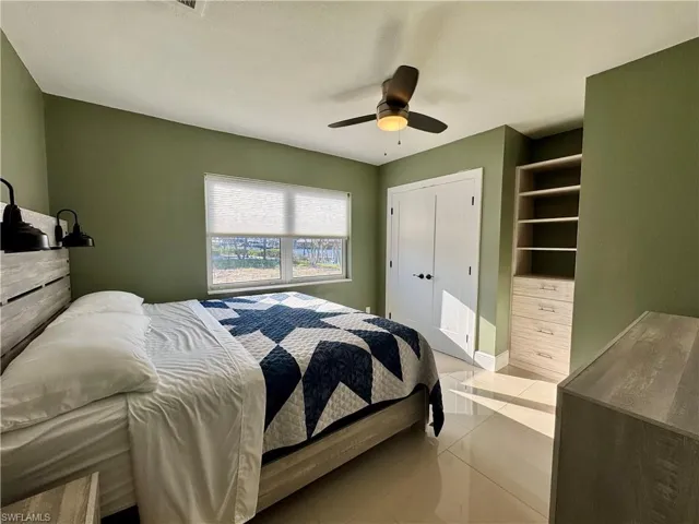 Tiled bedroom with ceiling fan