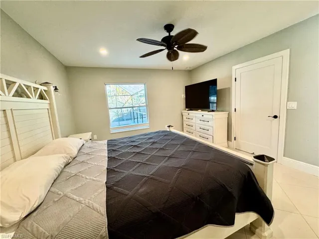 Bedroom featuring ceiling fan and light tile patterned floors