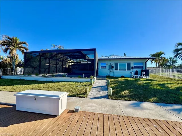 Deck with glass enclosure and a yard