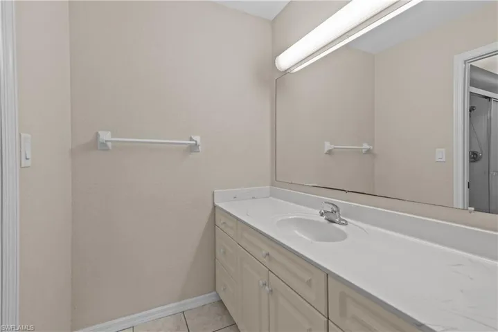 Bathroom with vanity and tile patterned flooring