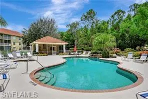 Community pool with a patio area