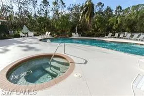 Pool with a patio area and a community hot tub