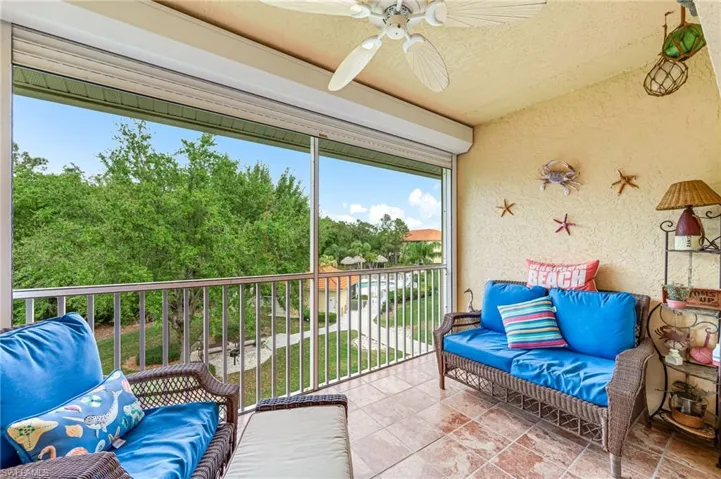 Sunroom featuring ceiling fan