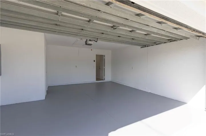Garage featuring a garage door opener