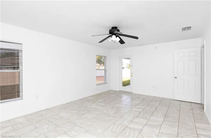Unfurnished room featuring ceiling fan