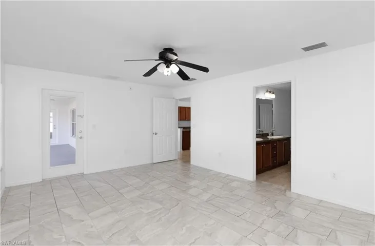 Empty room with ceiling fan and sink