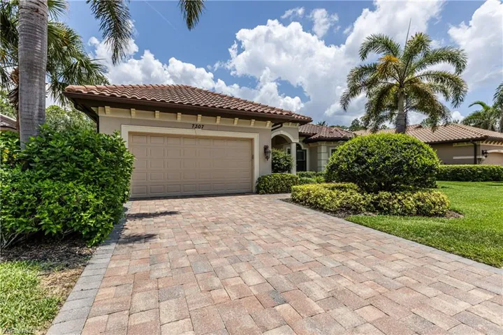 Mediterranean / spanish-style home featuring stucco siding, decorative driveway, an attached garage, and a tiled roof