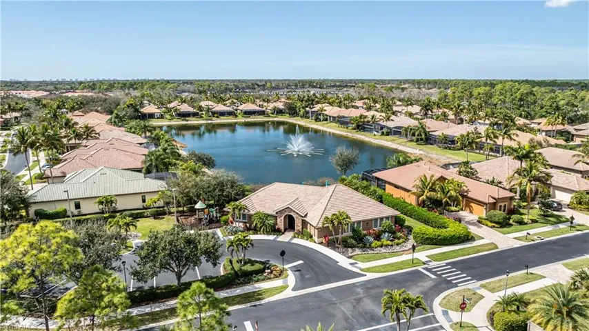 Aerial perspective of suburban area with a nearby body of water