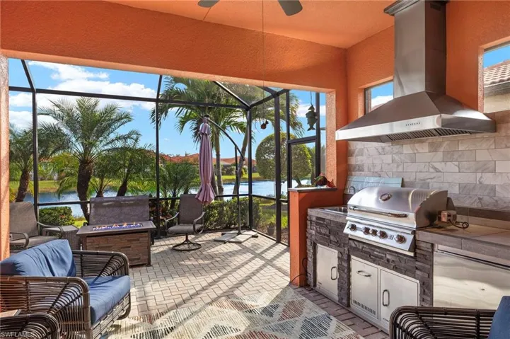 Relax next to the water on your extended lanai with a fire pit and outdoor kitchen.