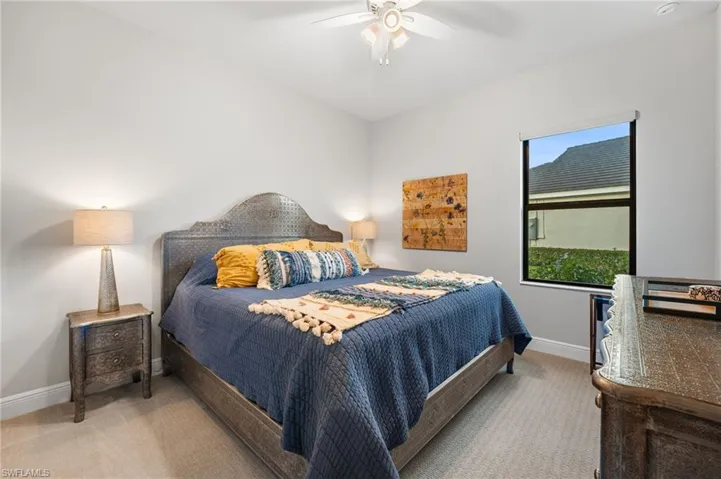 Bedroom featuring ceiling fan and carpet floors