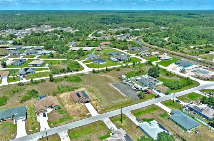 Aerial overview of property's location featuring nearby suburban area