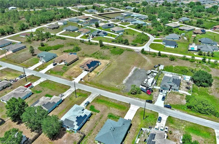 Aerial overview of property's location with nearby suburban area