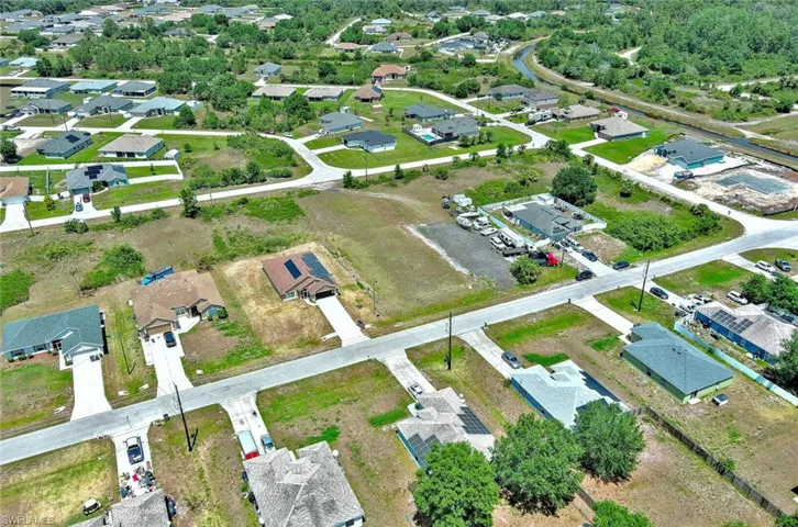 Aerial overview of property's location with nearby suburban area