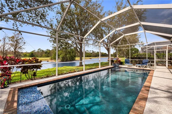 Stunning pool deck with scenic views of the lush landscape.