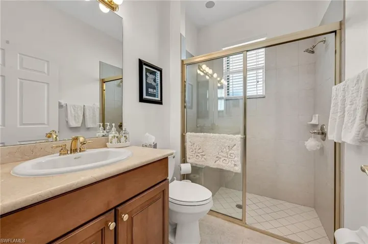 A full bathroom is located in the hallway between guest bedroom one and two.