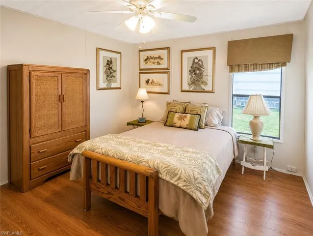 Bright room featuring wood-finish flooring and a window with a fabric valance