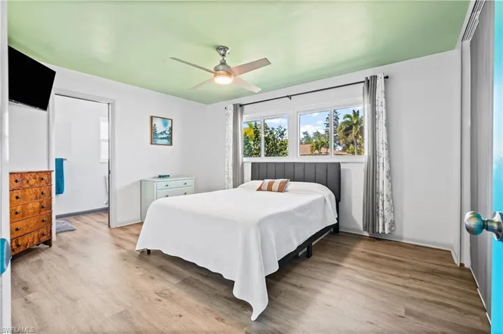 Bedroom featuring wood finished floors and ceiling fan