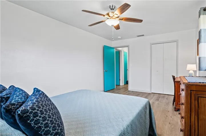 Bedroom with light wood-style flooring and ceiling fan